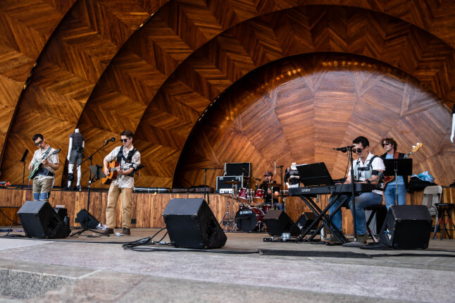 A group of Harvard SEAS students performing at the Hatch Memorial Shell in Boston