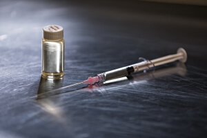 image of bottle and syringe