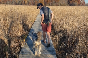 Trevor Cobb and his dog, Rufio, taking a walk
