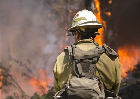 This rendering shows an INFERNODES device clipped to a firefighter's helmet