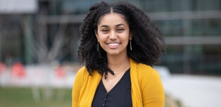 Rahel Imru standing outside in front of the Science and Engineering Complex building