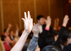 image of raised hands