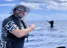 Michael Bell, Ph.D. '21, with a whale