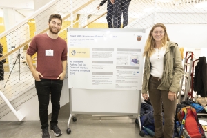 Noah Zweben and Elena Horton with their poster at the Technology Showcase