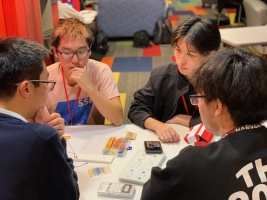 Four DexteriKey members work on their project