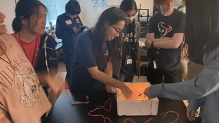 Students from Bellaire High School in Texas experiment with quantum superconductivity during the &quot;Quantum Engineering Research and You&quot; outreach program.