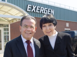 Francesco and Marybeth Pompei standing in front of Exergen, their medical device company