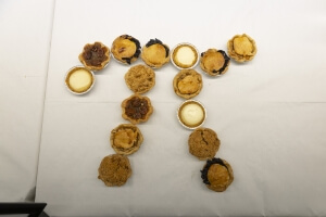 A collection of small pies arranged into the Greek symbol pi