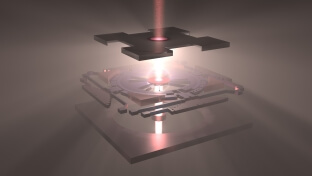 A 3D rendering of a the layered twisted moiré photonic crystal device emitting a central beam of light, with a metallic and geometric design.