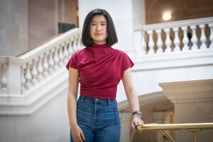Harvard SEAS student Emma Yang in front of a stairwell
