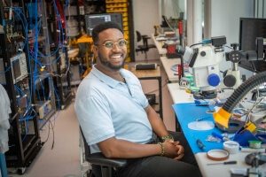 Harvard SEAS student Gregory Cunningham at a work bench