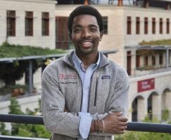 Harvard SEAS alum Chibuike Uwakwe, A.B. '23, wearing a Stanford Medicine shirt
