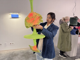 Harvard SEAS student Kausalya Mahadevan with an illuminated fabric