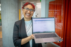 Harvard SEAS student Ellen Caraballo holding a laptop